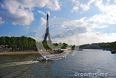 Tour Boat by Eiffel Tower Stock Photo