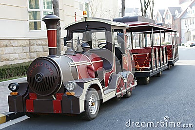 Tour bus like a small train Stock Photo