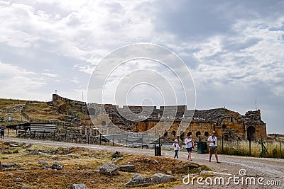 Tour groups on the ruins of Hierapolis. Tourists are shown the ruins of the ancient city Editorial Stock Photo