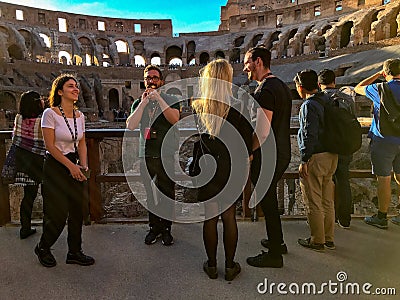 Tour guides and tourists at the Colosseum, Rome, Italy Editorial Stock Photo