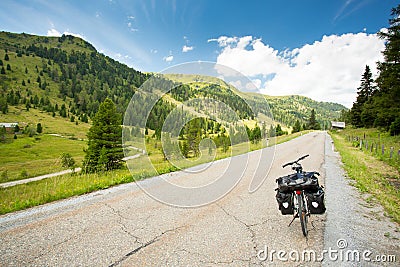 Touring bike on alpine road Stock Photo