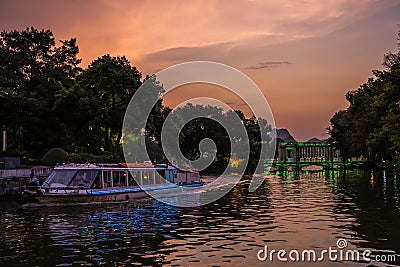 Touring boat on the Shan Lake at dusk Editorial Stock Photo