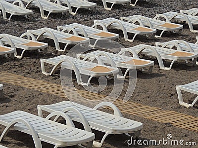 Tourism beach sand leisure sun beds nobody Stock Photo