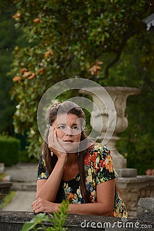 Girl in the garden near the Palace. Stock Photo