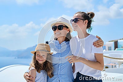 Tourism, travel, Greece, Santorini. Happy travelers mom and daughters Stock Photo