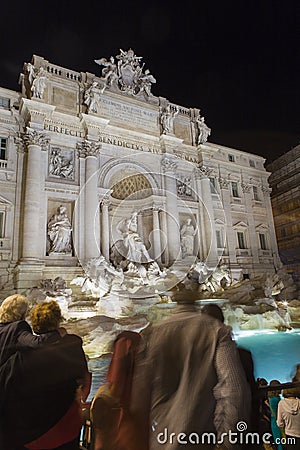 Tourist admiring the Trevi Fountain from Rome Stock Photo