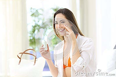 Tourist applying sunscreen protection on summer vacations Stock Photo