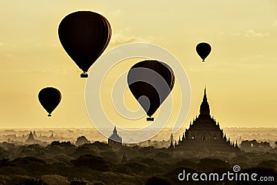 Tourist Balloons over Pagoda at Sunrise, Bagan, Myanmar Stock Photo