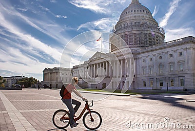 Tourist on a bike pause to look at the Capitol Building in Washington DC, USA Editorial Stock Photo