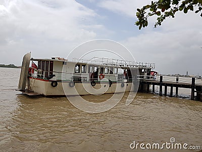 Tourist boat docked on the Suriname river along the waterfront in Paramaribo Suriname. Editorial Stock Photo