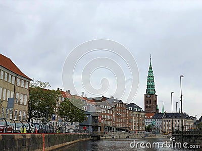 Tourist boat on Gammel Strand canal. Nikolaj Kirke Church and Thorvaldsens museum on the background at Copenhagen Editorial Stock Photo