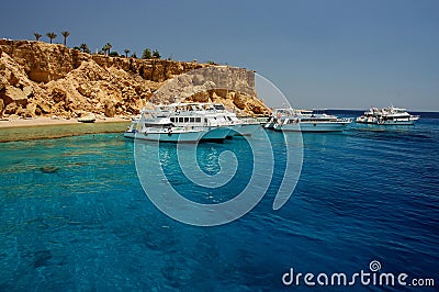 Tourist boats anchored by the island, Sharm El Sheikh, Sinai Peninsula, Red Sea, Egypt. Editorial Stock Photo