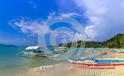 Tourist boats by a beach in Port Barton Editorial Stock Photo