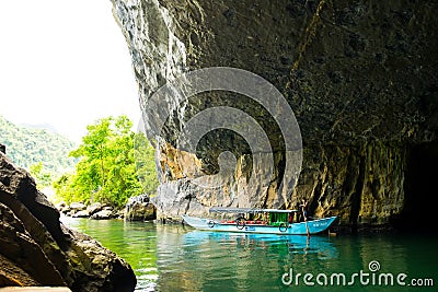 Tourist boats, the mouth of Phong Nha cave with underground river, Phong Nha-Ke Bang National Park, Vietnam Editorial Stock Photo