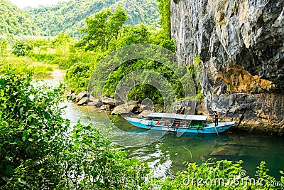 Tourist boats, the mouth of Phong Nha cave with underground river, Phong Nha-Ke Bang National Park, Vietnam Editorial Stock Photo