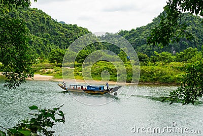 Tourist boats, the mouth of Phong Nha cave with underground river, Phong Nha-Ke Bang National Park, Vietnam Editorial Stock Photo