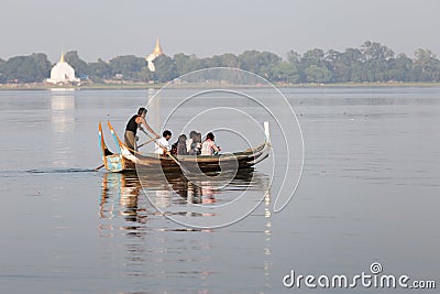 Tourist Boats Taungthaman Lake near Amarapura in Myanmar by the U Bein Bridge Editorial Stock Photo