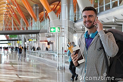Tourist calling by phone arriving safe and sound Stock Photo