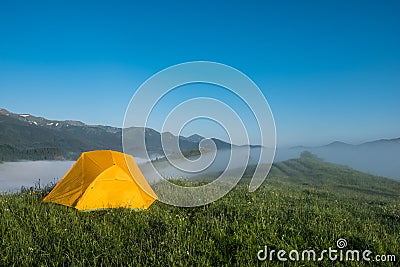 Tourist camping tent in a mountains. Beauty world Stock Photo