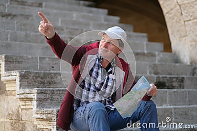 Tourist with city plan Stock Photo