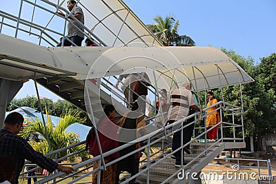 Tourist Climbing on Air stairs of Tu-142 Aircraft Editorial Stock Photo