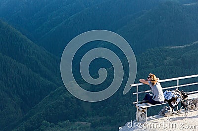 Tourist enjoying mountain view Stock Photo