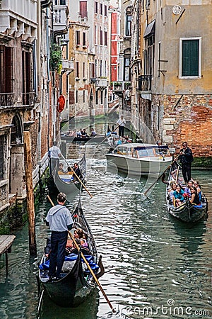 Tourist enjoying a ride on a Gondola, Venice Italy Europe Editorial Stock Photo