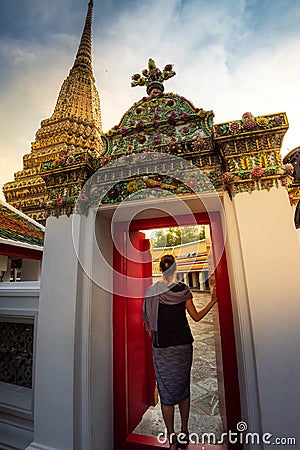 Tourist enters Phra Maha Chedi Si Ratchakan Stock Photo