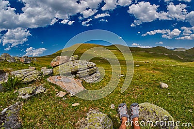 Tourist feet high-altitude abstract mountain landscape Stock Photo