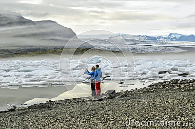 Tourist at FjallsÃ¡rlÃ³n glacier lagoon in south Iceland Editorial Stock Photo