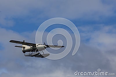 Tourist float plane prepares to land on the Tongass Narrows Stock Photo