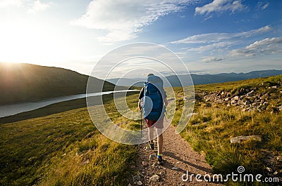 Tourist friends on a top of mountains in a Scottish Highlands. Scotland nature. Tourist people enjoy a moment in a nature. Touris Stock Photo
