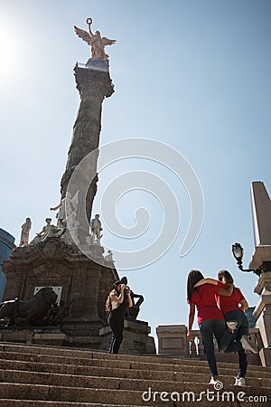 Tourist girfriends taking picture together, Angel de la Indepedencia Editorial Stock Photo