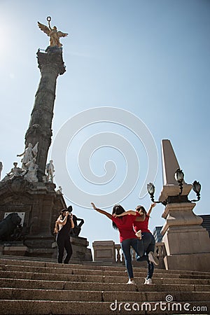 Tourist girfriends taking picture together, Angel de la Indepedencia Editorial Stock Photo