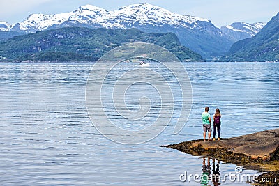 Tourist girl at the Hardangerfjorden Stock Photo