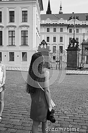 Tourist girl in a red dress stands Editorial Stock Photo