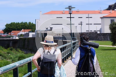 Tourist going to bird watching tour with guide Editorial Stock Photo