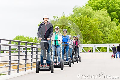 Tourist group driving Segway at sightseeing tour Stock Photo