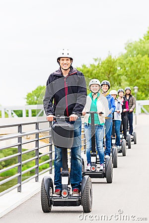 Tourist group driving Segway at sightseeing tour Stock Photo