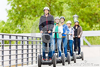 Tourist group driving Segway at sightseeing tour Stock Photo