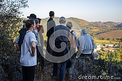 A tourist group looking out over a rural village, Myanmar Editorial Stock Photo