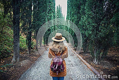 Tourist in hat at cypress alley Stock Photo