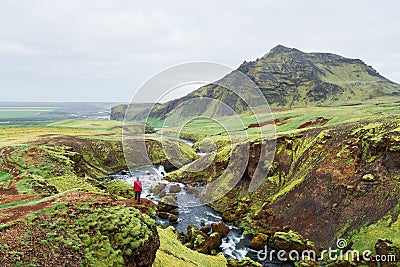 Tourist on a hike in Iceland near the Skoga River Stock Photo