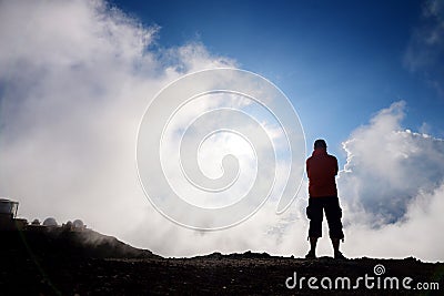 Tourist hiking in Haleakala volcano crater on the Sliding Sands trail. Stock Photo