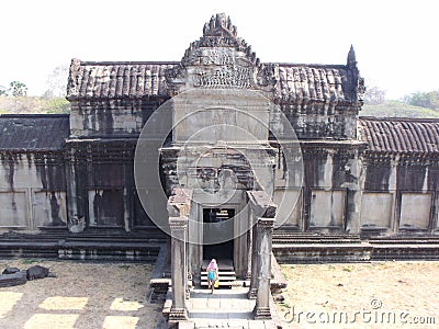 A tourist inside the Angkor Wat temple in the Khmer temple complex of Angkor Stock Photo