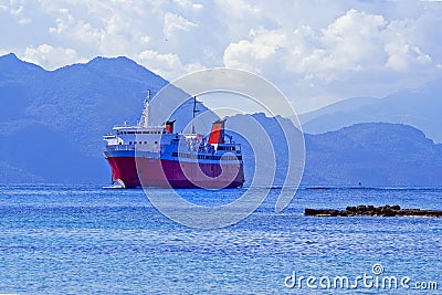 Tourist liner approaches the island of Aegina in Greece on a clear day Editorial Stock Photo