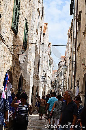Tourist in Little tipical street in the old town of Dubrovnik Editorial Stock Photo