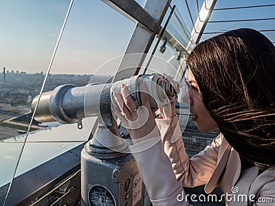 Tourist look observant binoculars telescope on panoramic view Stock Photo