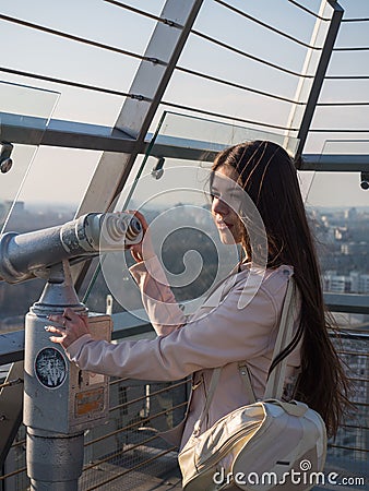 Tourist look observant binoculars telescope on panoramic view Stock Photo