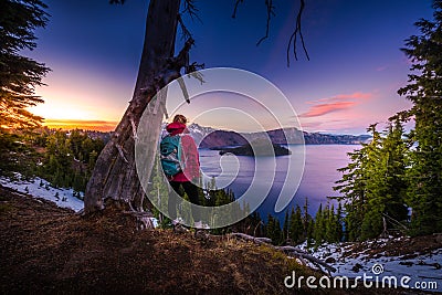 Tourist looking at Crater Lake Oregon Landscape Stock Photo